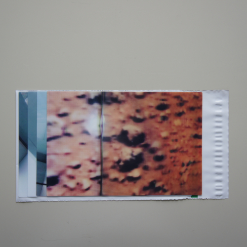 ‘wish I could be in sindanao with you, I’m sure sindanao is beautiful, such a drag I can’t be there, damn’, 2013, three lenticular photographs of the then future site of M+ as seen from the Sky 100 Hong Kong Observation Platform, one of an image from the surface of Mars, 15.5 x 23 cm each, a fragment of a conversation about fictional islands between Edgar Schmitz and Ulli Lommel, orange plastic sleeve, 17 x 29.5 cm, overall dimensions variable, edition of 5+2 e.a.